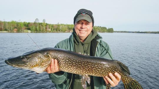 Man holding a northern on Lake Vermilion