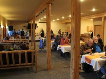 Guests enjoy a mean in the basement of the Grand Vermilion Chalet