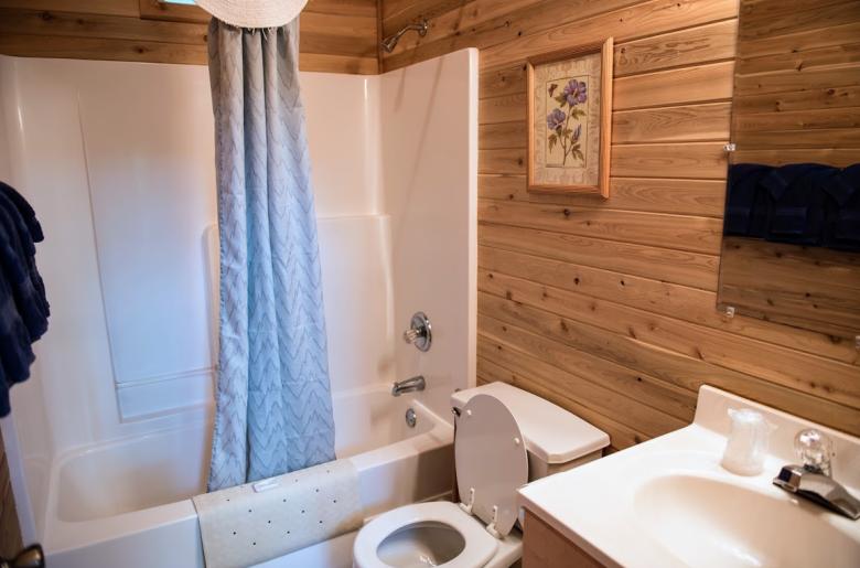 Bathroom with a standard tub/shower.