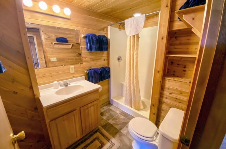 Bathroom with an oversized shower stall.