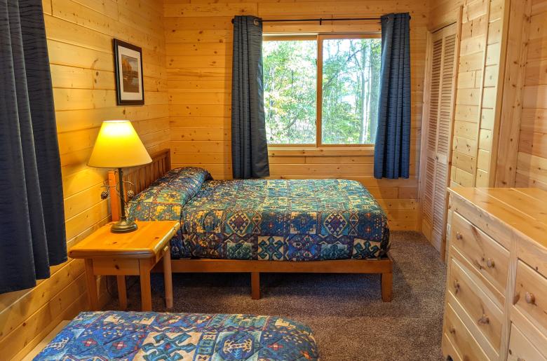 Bedroom with a full size bed and twin.