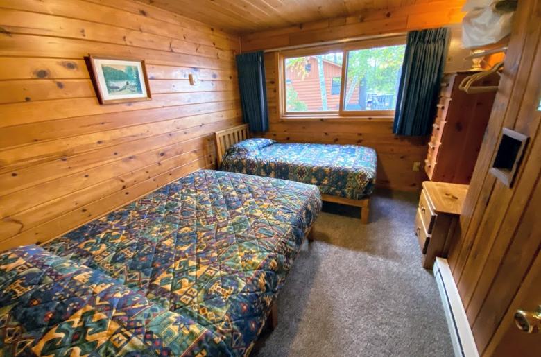 Bedroom with a full size bed and twin.