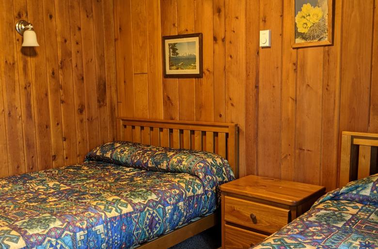 Bedroom with a full size bed and twin.