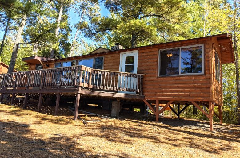 Exterior of Sunset View, nestled in the pines and views of the lake.