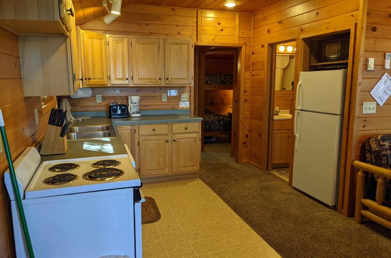 Kitchen with a refrigerator, stove, and dishwasher.