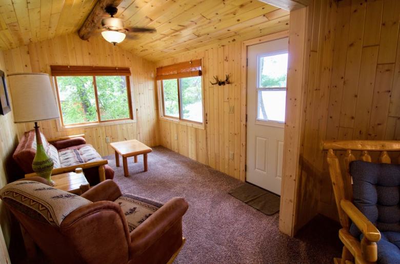 Living area with a futon and chair.