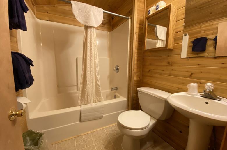 Bathroom with a standard tub/shower.