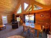 Dining area with seating and patio doors to the covered porch seating.