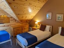 Upstairs bedroom with two XL twins and a regular twin.