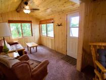 Living area with a futon and chair.