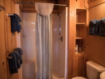 Main floor bathroom with a wide door and easy access shower and sink.