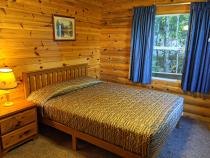 Main floor bedroom with a queen bed.