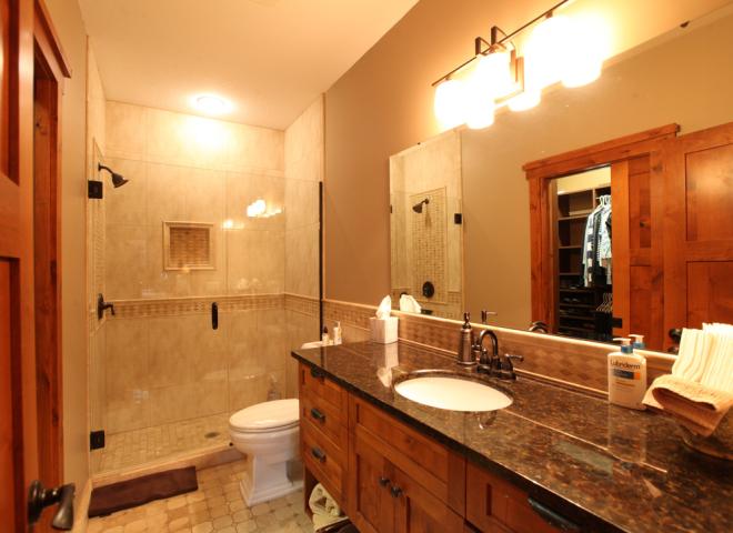Master bedroom bathroom with shower and granite.