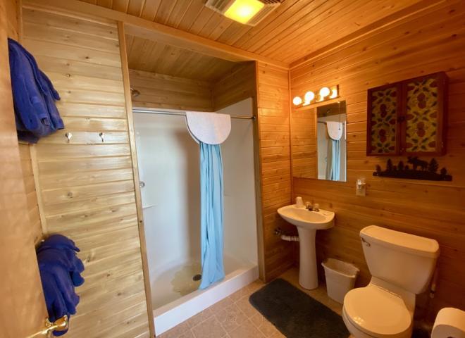 Bathroom with an easy access sink and shower stall.
