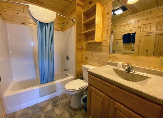 Loft bathroom with a standard tub/shower.
