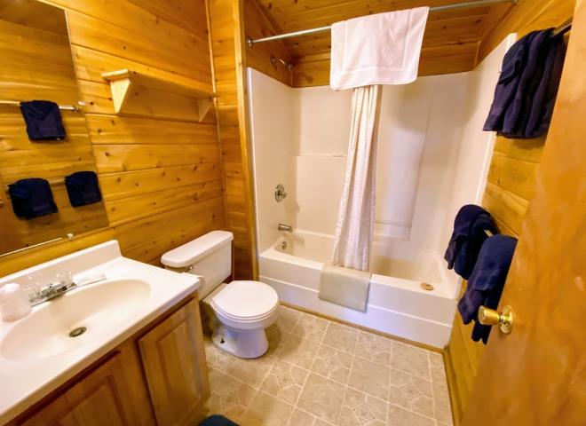Bathroom with a standard tub/shower.