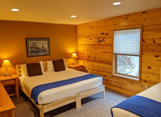 Main floor bedroom with king and twin bed.