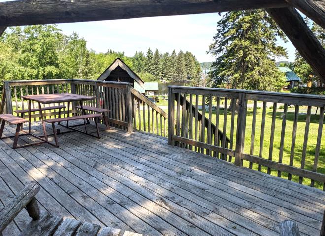 Deck seating overlook the harbor and bait and tackle shop.