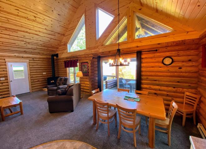 Dining area with seating and patio doors to the covered porch seating.