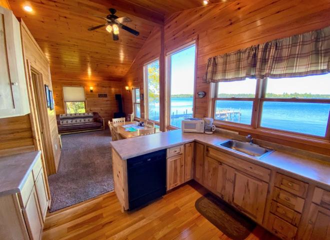 Kitchen with a refrigerator, stove, and dishwasher.