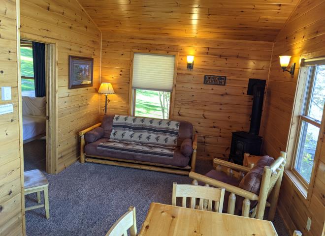 Living are with a futon and chair.