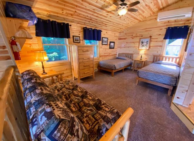 Loft bedroom with two twins and a futon.