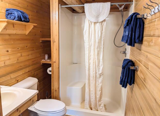 Main floor bathroom with a wide door and easy access shower and sink.