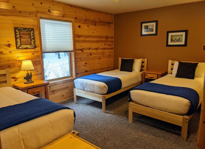 Main floor bedroom with two XL twins and one regular twin.