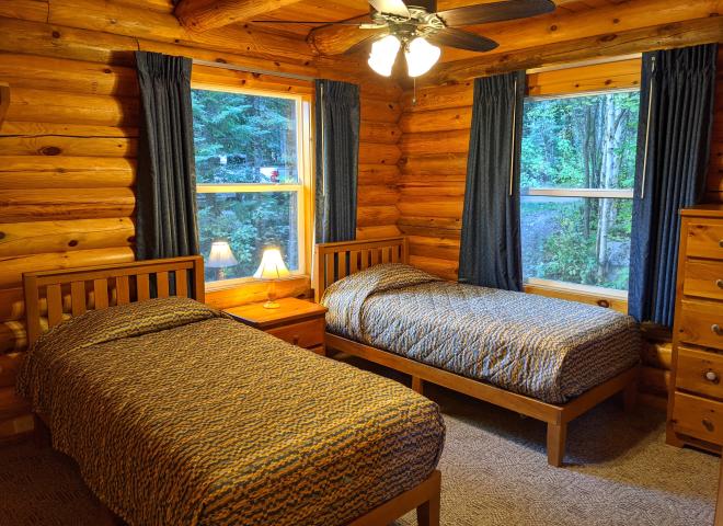Main floor bedroom with two twin beds.