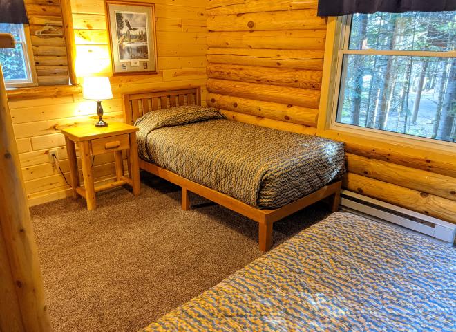 Main floor bedroom with two twin beds.