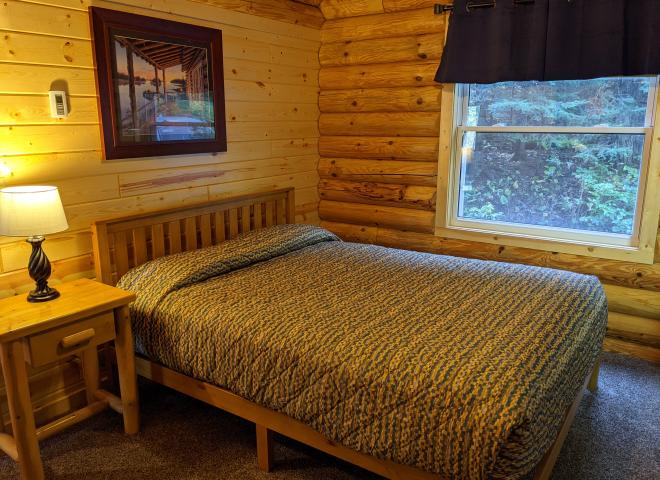Main floor bedroom with a queen bed.