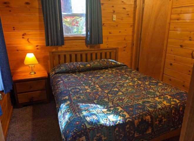 Bedroom with a queen bed and ensuite bathroom.