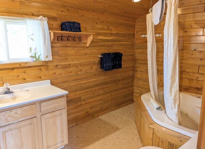 Loft bathroom with an oversized whirlpool tub/shower.