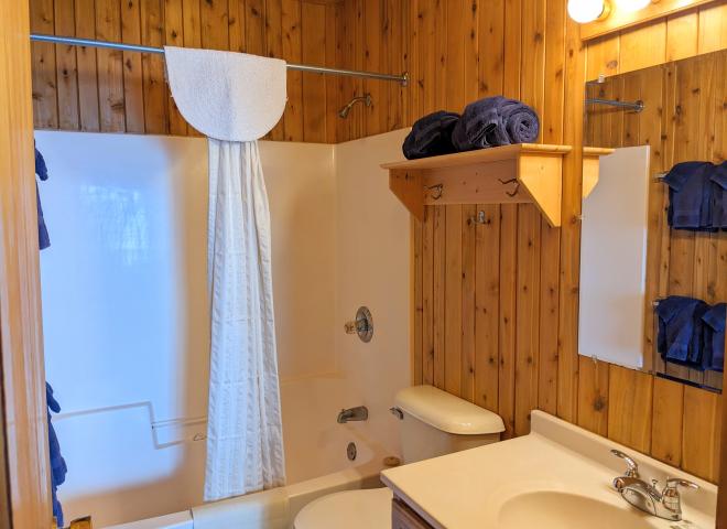 Bathroom with a standard tub/shower.