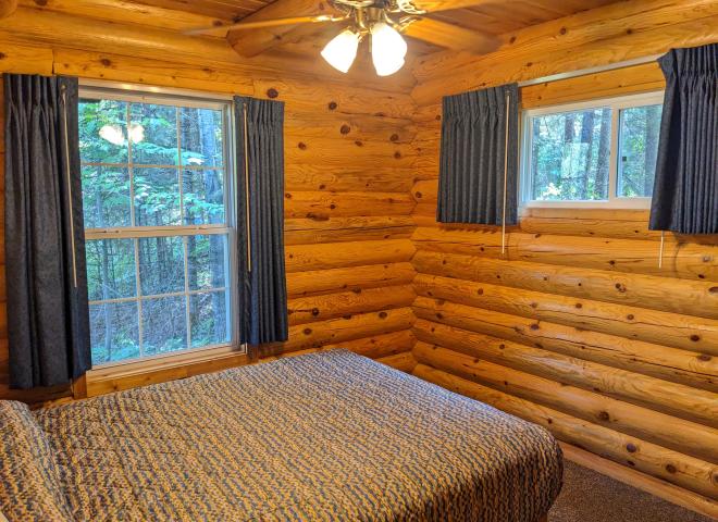 Main floor bedroom with a queen bed.