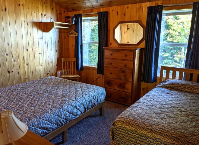 Upstairs bedroom with a queen and twin bed.