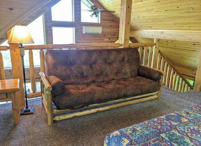 Loft area with a futon.