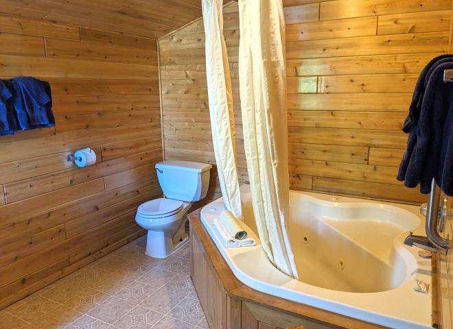 Loft bathroom with an oversized whirlpool tub/shower.
