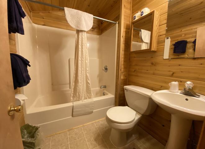 Bathroom with a standard tub/shower.