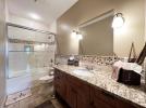 Lower level ensuite bath with tub/shower and granite (Lake View Suite)