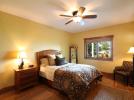 Lower level ensuite bedroom with lake view and queen bed