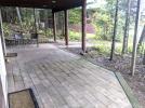 Walk out, ground patio from the downstairs bedrooms, leading to the beach.