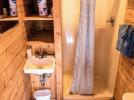 Small bathroom with a walk-in shower stall.