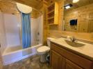 Upstairs bathroom with a standard tub shower.