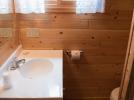 Bathroom with small shower stall.