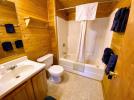 Bathroom with a standard tub and shower.