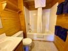 Bathroom with a standard tub and shower.