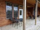 Deck area with seating and gas fireplace.