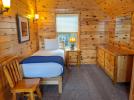 Loft bedroom with a twin bed and a dresser.