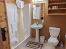 Main floor bathroom with easy access shower, sink, and wide doors.